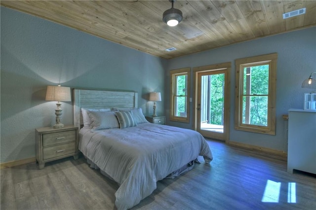 bedroom with access to exterior, wood ceiling, and light hardwood / wood-style flooring