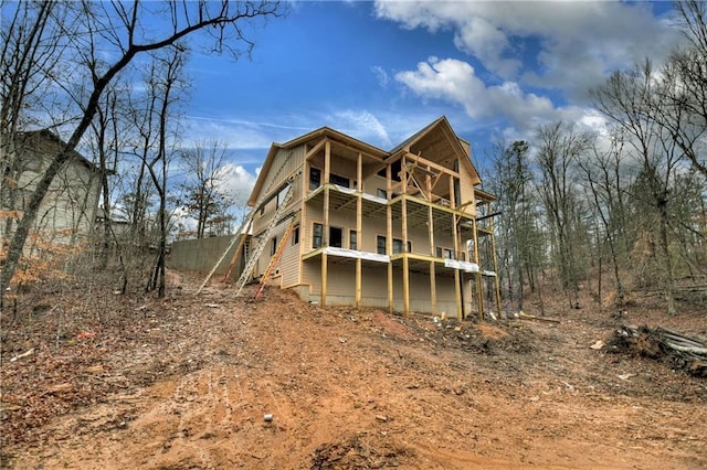 rear view of house with a balcony