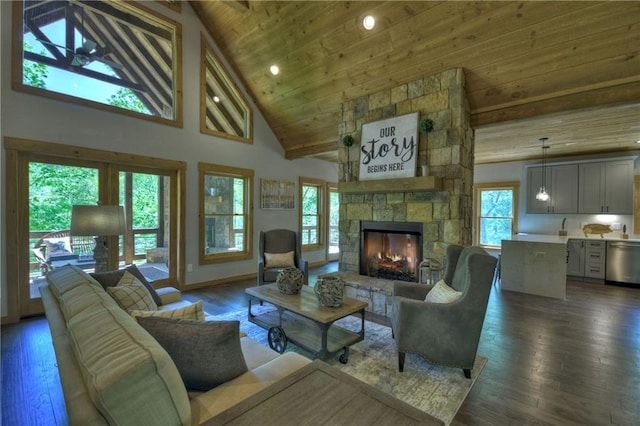 living room with wood ceiling, dark hardwood / wood-style flooring, high vaulted ceiling, and a stone fireplace