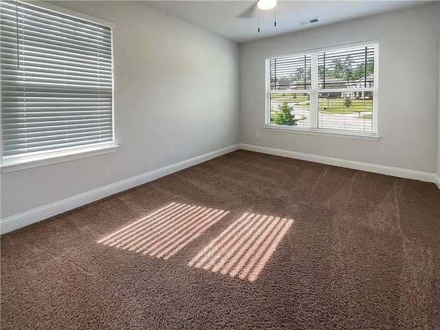 unfurnished room featuring ceiling fan and carpet floors