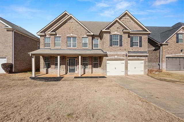 view of front of property with a porch and a garage