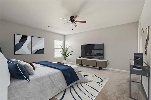 bedroom with light colored carpet and ceiling fan