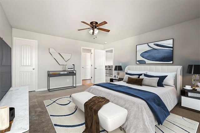 bedroom with dark colored carpet and ceiling fan