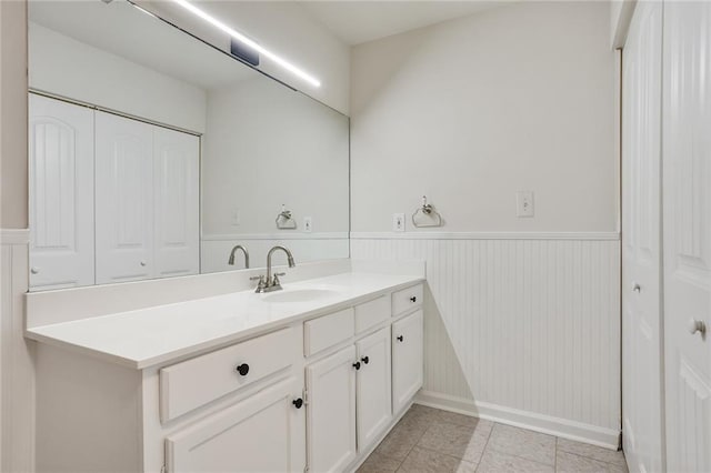 bathroom featuring tile patterned flooring and vanity