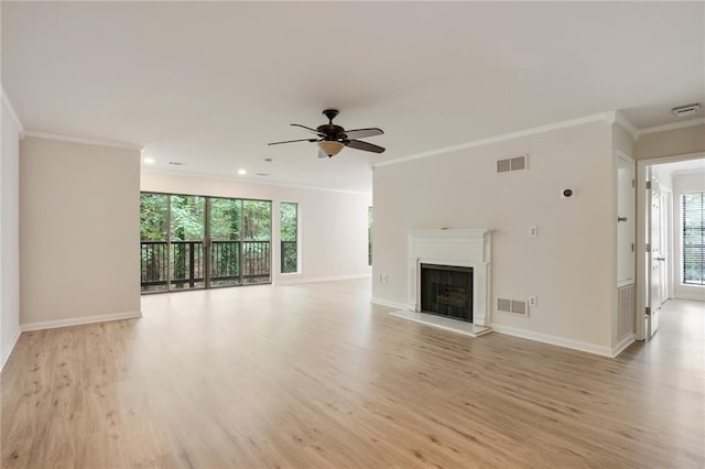 unfurnished living room with light hardwood / wood-style flooring, ceiling fan, plenty of natural light, and crown molding