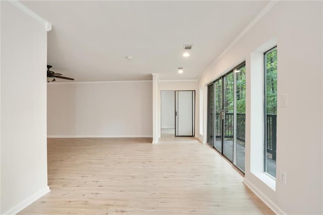 empty room with ceiling fan, light wood-type flooring, and ornamental molding