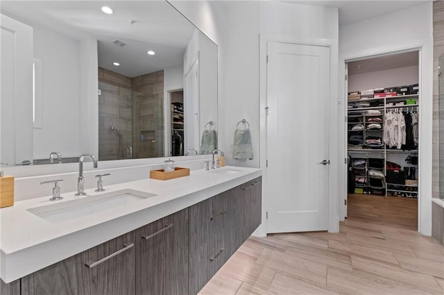 1494 Red Fox Dr NE Unit D, Atlanta, GA 30306 - full bath with a walk in closet, double vanity, a shower stall, and recessed lighting