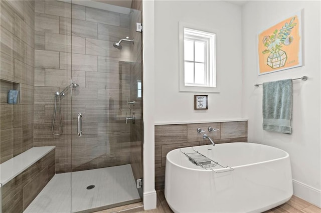 1494 Red Fox Dr NE Unit D, Atlanta, GA 30306 - bathroom featuring a freestanding bath, a stall shower, and wood finished floors
