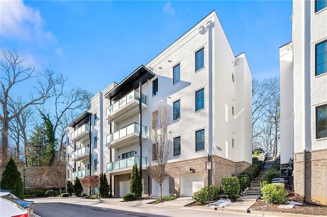 1494 Red Fox Dr NE Unit D, Atlanta, GA 30306 - view of apartment building / complex featuring an attached garage