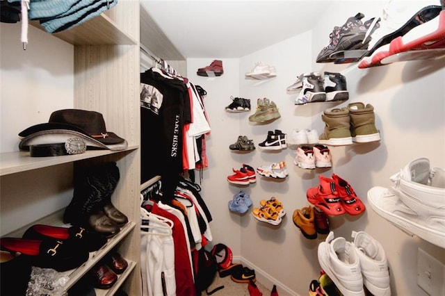 spacious closet with carpet floors