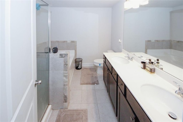 bathroom with a shower stall, a bath, double vanity, tile patterned floors, and toilet
