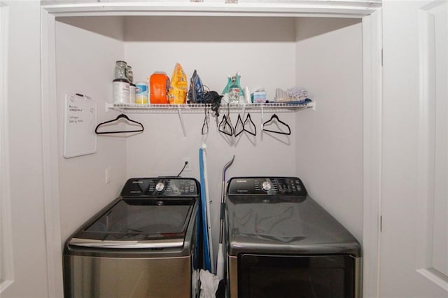 laundry room featuring separate washer and dryer