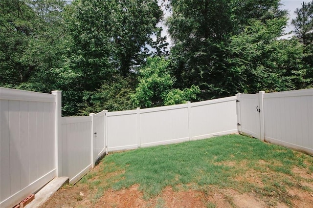 view of yard with a gate