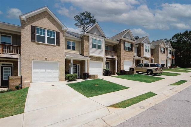 view of property featuring brick siding, driveway, an attached garage, a residential view, and a front lawn