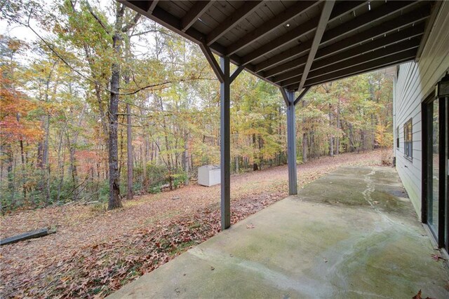 laundry area with electric panel, light hardwood / wood-style flooring, and independent washer and dryer