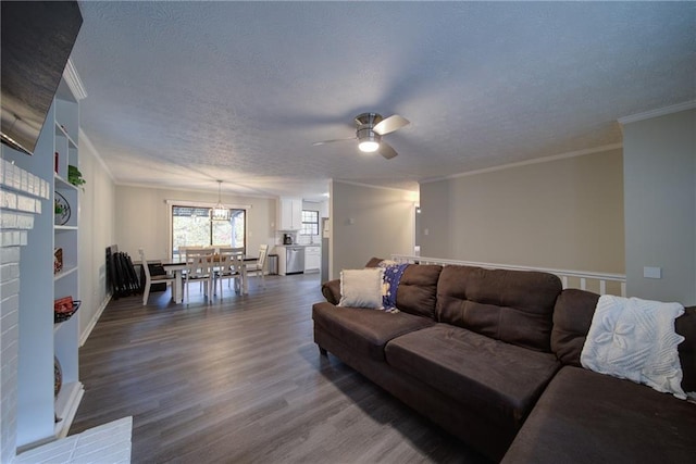 living room with a textured ceiling, hardwood / wood-style flooring, ceiling fan, and crown molding