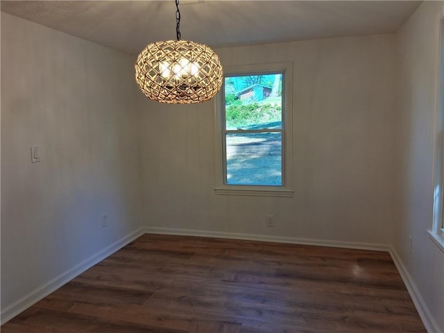 816 Stewart St, Carrollton, GA 30117 - unfurnished dining area featuring dark wood-style floors, baseboards, and a notable chandelier