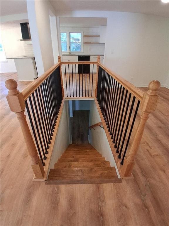 816 Stewart St, Carrollton, GA 30117 - stairway featuring baseboards and wood finished floors