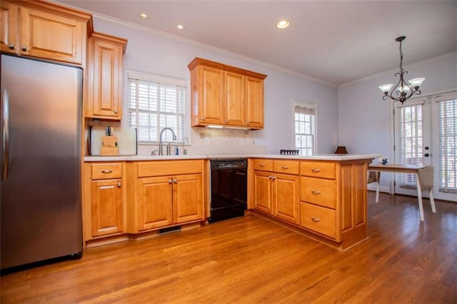 2003 Hubbard Ct, Villa Rica, GA 30180 - kitchen with stainless steel built in refrigerator, black dishwasher, a peninsula, light wood-style floors, and healthy amount of natural light
