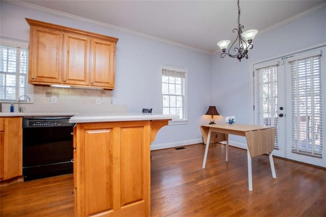 2003 Hubbard Ct, Villa Rica, GA 30180 - kitchen featuring dishwasher, wood finished floors, light countertops, tasteful backsplash, and crown molding