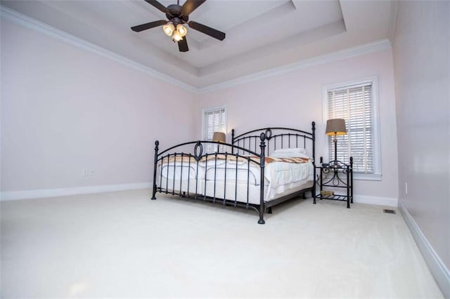 2003 Hubbard Ct, Villa Rica, GA 30180 - bedroom with carpet floors, a tray ceiling, baseboards, crown molding, and ceiling fan