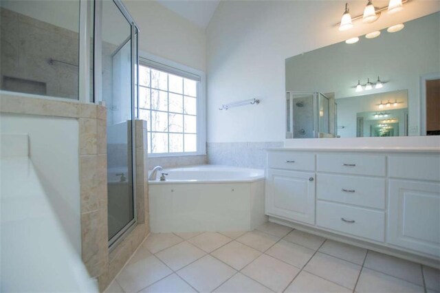2003 Hubbard Ct, Villa Rica, GA 30180 - full bathroom with tile patterned floors, a bath, vanity, and a shower stall