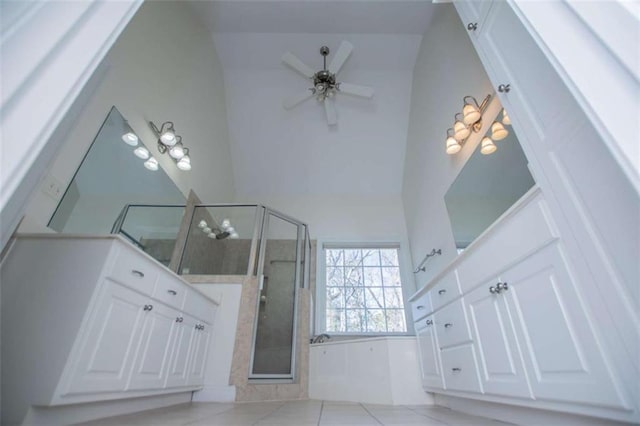 2003 Hubbard Ct, Villa Rica, GA 30180 - bathroom with a stall shower, tile patterned floors, ceiling fan, high vaulted ceiling, and vanity
