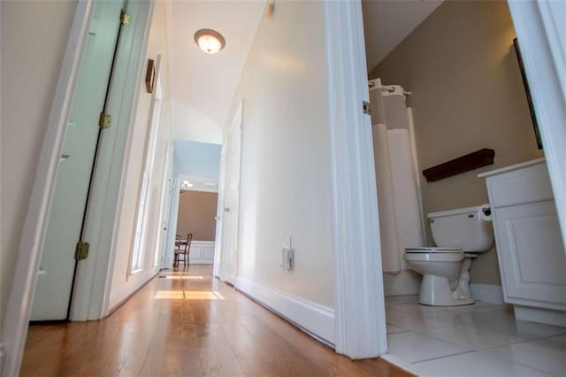 2003 Hubbard Ct, Villa Rica, GA 30180 - bathroom featuring toilet, wood finished floors, and a shower with shower curtain