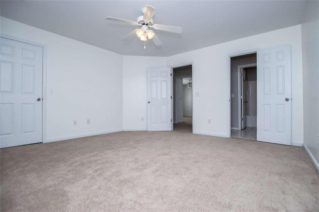 2003 Hubbard Ct, Villa Rica, GA 30180 - unfurnished bedroom with carpet floors, baseboards, and a ceiling fan