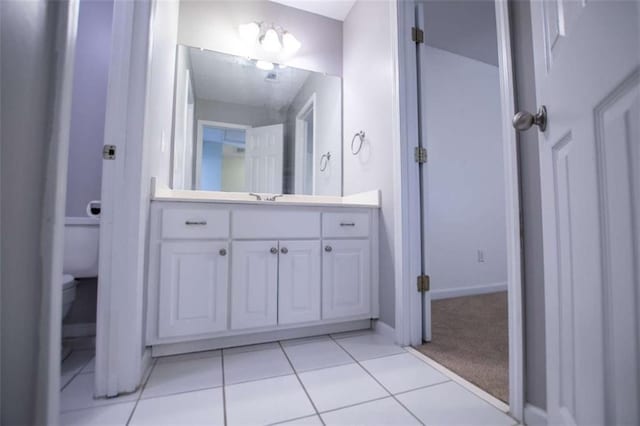 2003 Hubbard Ct, Villa Rica, GA 30180 - bathroom featuring toilet, vanity, tile patterned floors, and baseboards