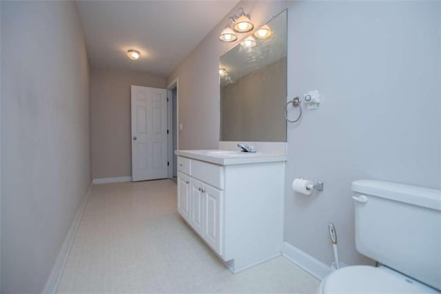 2003 Hubbard Ct, Villa Rica, GA 30180 - bathroom featuring vanity, toilet, and baseboards