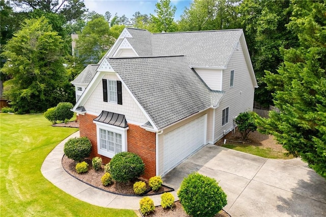 2003 Hubbard Ct, Villa Rica, GA 30180 - view of side of property featuring brick siding, a shingled roof, an attached garage, a lawn, and driveway