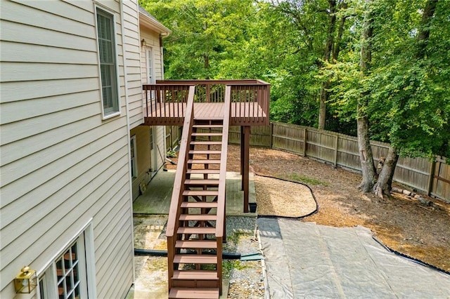 2003 Hubbard Ct, Villa Rica, GA 30180 - fenced backyard featuring stairs and a wooden deck