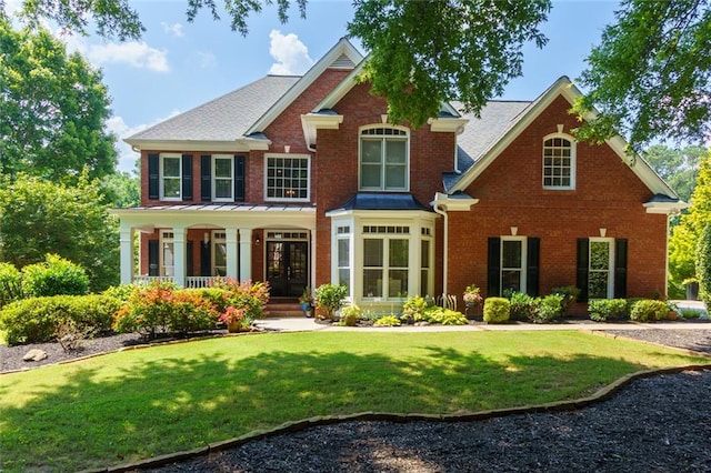 130 Hamilton Way, Roswell, GA 30075 - view of front facade featuring brick siding, a front lawn, and a porch