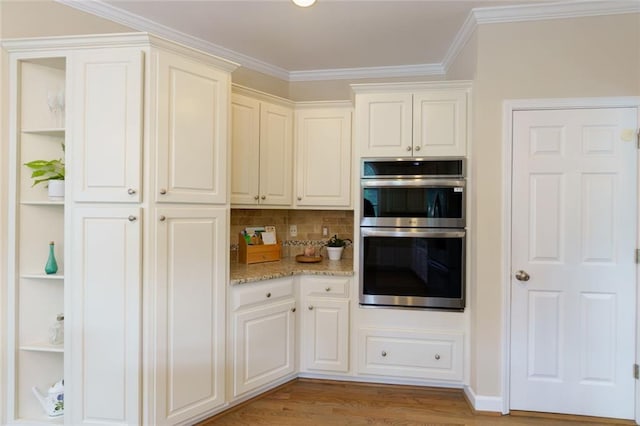 130 Hamilton Way, Roswell, GA 30075 - kitchen with double oven, light stone counters, light wood-style flooring, ornamental molding, and decorative backsplash