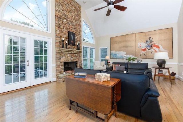 130 Hamilton Way, Roswell, GA 30075 - living area with high vaulted ceiling, wood finished floors, a ceiling fan, a fireplace, and french doors