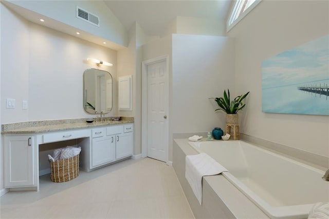 130 Hamilton Way, Roswell, GA 30075 - bathroom with vanity, a bath, high vaulted ceiling, and recessed lighting