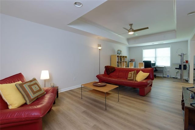 130 Hamilton Way, Roswell, GA 30075 - living area featuring a raised ceiling, ceiling fan, and light wood finished floors