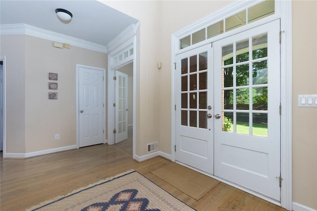 130 Hamilton Way, Roswell, GA 30075 - entrance foyer featuring french doors, ornamental molding, and wood finished floors