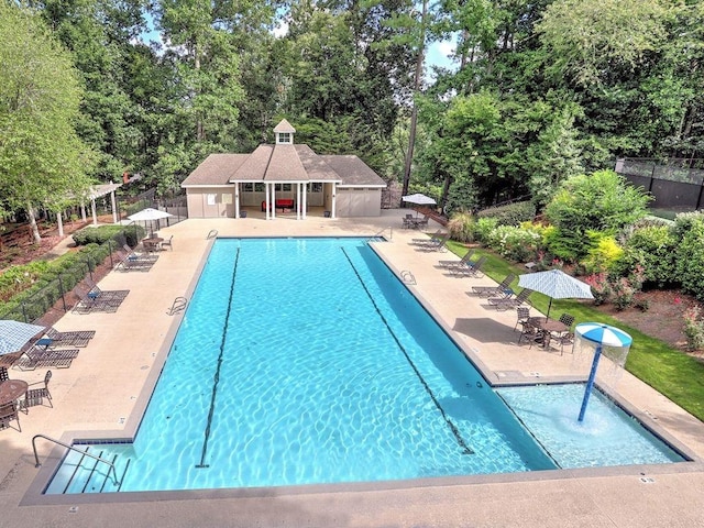 130 Hamilton Way, Roswell, GA 30075 - community pool featuring a patio area, an outdoor structure, and view of scattered trees
