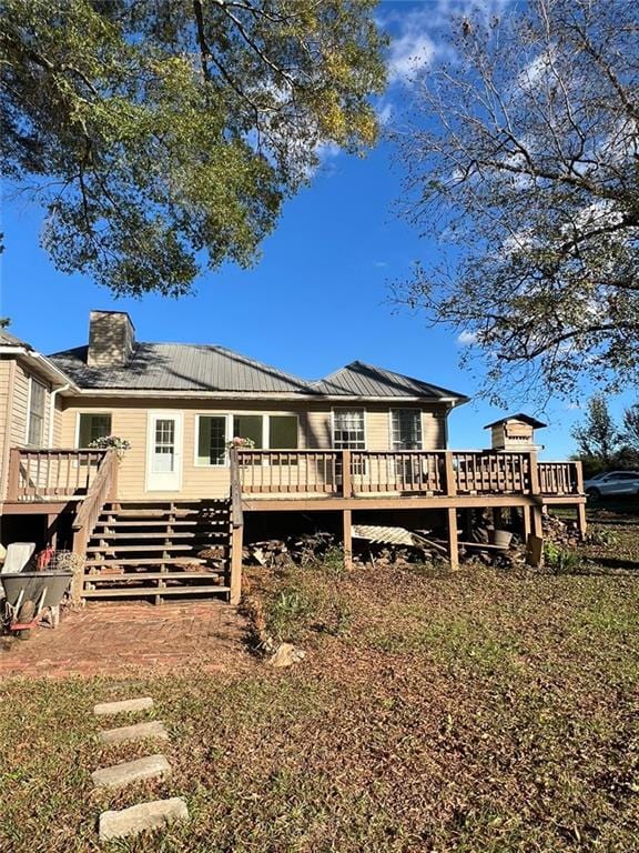 back of property with a wooden deck