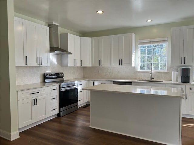 94 Cedar Valley Rd, Montezuma, GA 31063 - kitchen featuring stainless steel range with electric stovetop, a sink, wall chimney range hood, light countertops, and recessed lighting