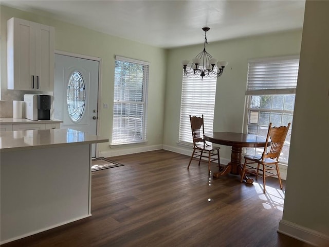 94 Cedar Valley Rd, Montezuma, GA 31063 - dining area with a chandelier, dark wood finished floors, and baseboards