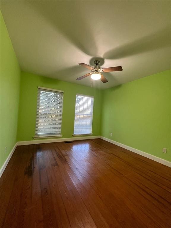 spare room featuring ceiling fan and wood-type flooring