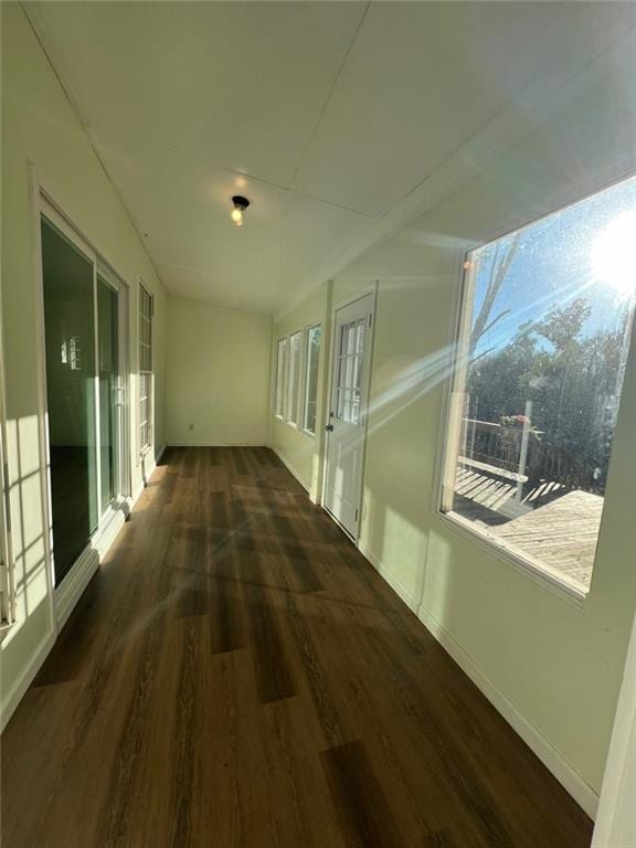 hallway with dark wood-type flooring