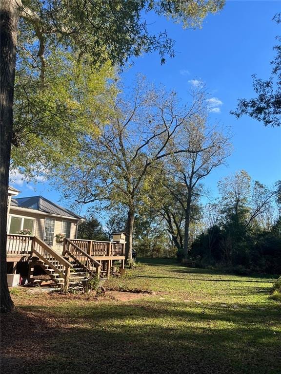 view of yard featuring a wooden deck