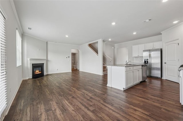 96 Quail Bend Way, Dallas, GA 30157 - kitchen with appliances with stainless steel finishes, ornamental molding, open floor plan, dark wood-style flooring, and recessed lighting