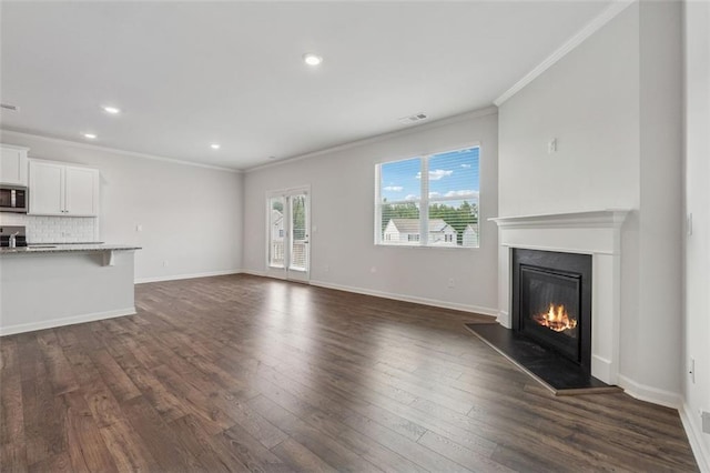 96 Quail Bend Way, Dallas, GA 30157 - unfurnished living room with crown molding, a glass covered fireplace, dark wood-style flooring, recessed lighting, and baseboards