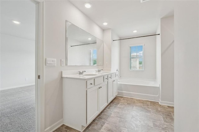 96 Quail Bend Way, Dallas, GA 30157 - bathroom with double vanity, a tub, baseboards, and recessed lighting