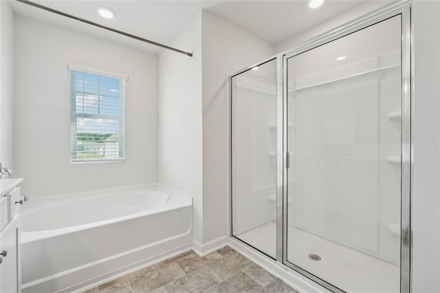 96 Quail Bend Way, Dallas, GA 30157 - bathroom featuring a shower stall, a bath, vanity, baseboards, and recessed lighting